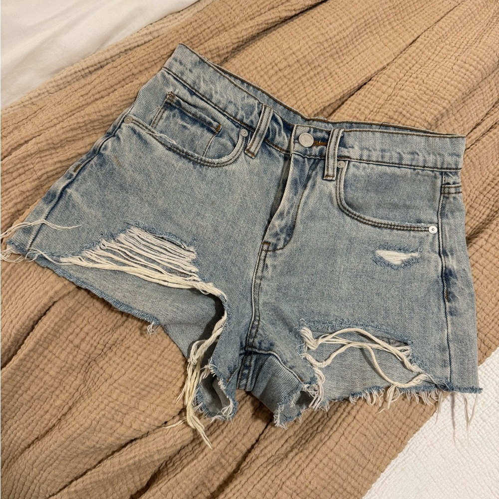 blank NYC ripped medium light wash denim shorts